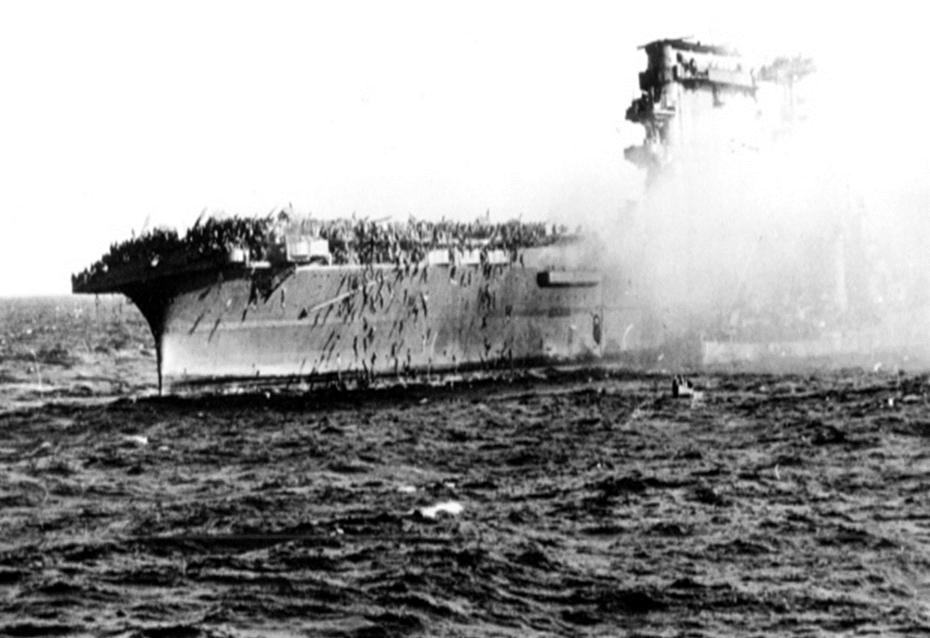 In this 1942 file photo, crew abandons the USS Lexington after
