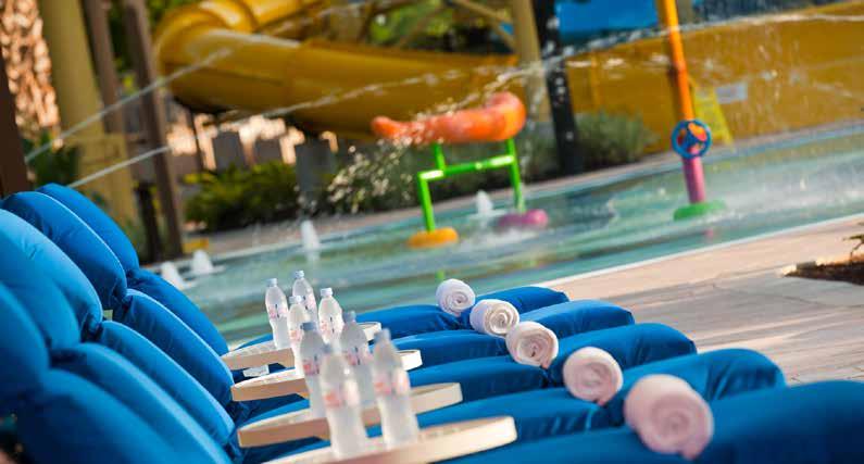 SOAK UP THE SUN IN STYLE Olympic-size heated pool with poolside bar &