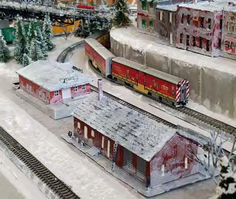 while two SDs lead a freight through town (upper right).