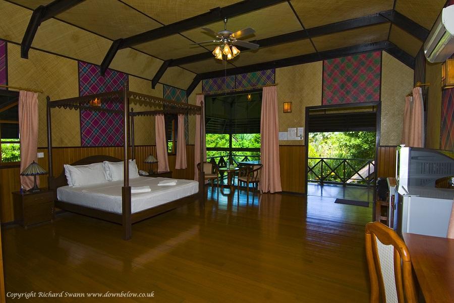 SEPILOK NATURE RESORT Within walking distance from the world-famous Sepilok Orang Utan Rehabilitation Centre, deep in a forest of tropical orchids and towering trees, this charming resort combines