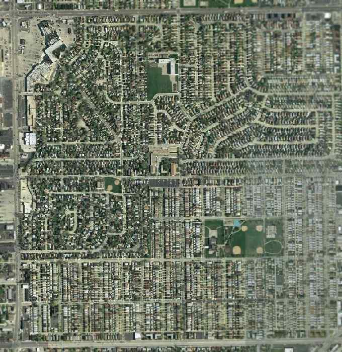 The 2002 USGS aerial photo showed the site has been densely redeveloped, with no trace visible of the former Ashburn