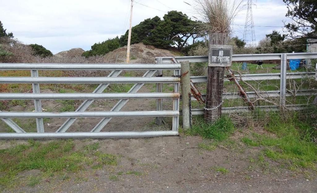 Figure 3. Trail entrance from 365 Lupin Avenue, Manila, CA a. Current metal gate, fence and no trespassing sign. b.