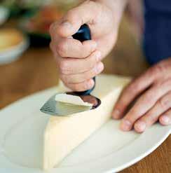 The wavy slicing blade lifts the cheese or vegetable slice from the blade.