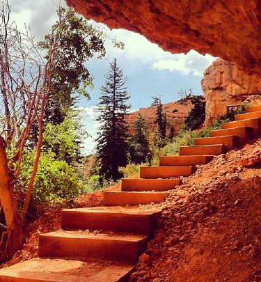 The trail takes some switchbacks that lead to a summit where there is a great view of Cedar City. There is a little slot canyon on the trail where some boldering or even repelling would be optional.