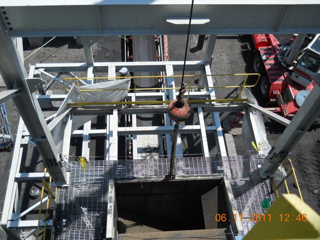 Appendix F: Photo of Chute on Second Floor Cable from Crane Beamer Location Cables for