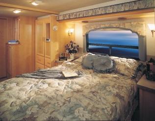 Convenience doesn t begin to describe Bounder Diesel s bedroom: built-in dresser, clothes hamper, 20" Panasonic