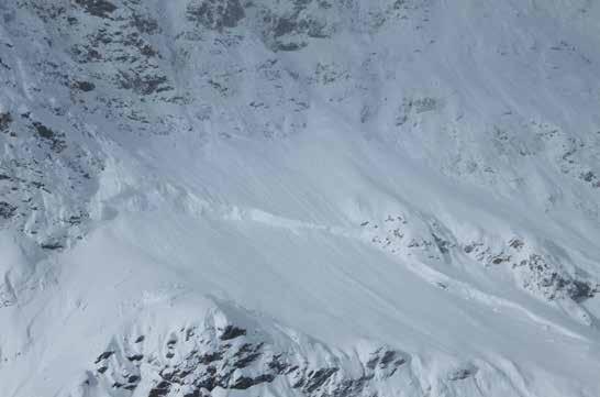 Slab avalanches generally occur when wind forms large layers of snow that slide down along a slope.