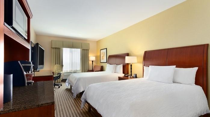Houston Room Amenities List For your Comfort 250 Thread Count Sheets Air Conditioning Arm Chair with Ottoman Black-Out Curtains Clock Radio w/ MP3 Connection Complimentary HBO(R)