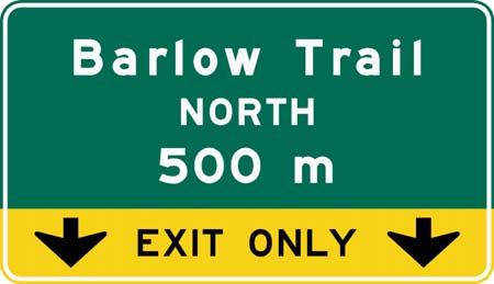 Overhead Exit Direction Signs should be located close to the gore point and above the appropriate lane. The decision to place guide signs overhead or ground mount is outlined in A4.3.11