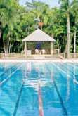 FROM 56 PER ADULT QT Port Douglas Set in tropical gardens only minutes from Port Douglas village and Four Mile