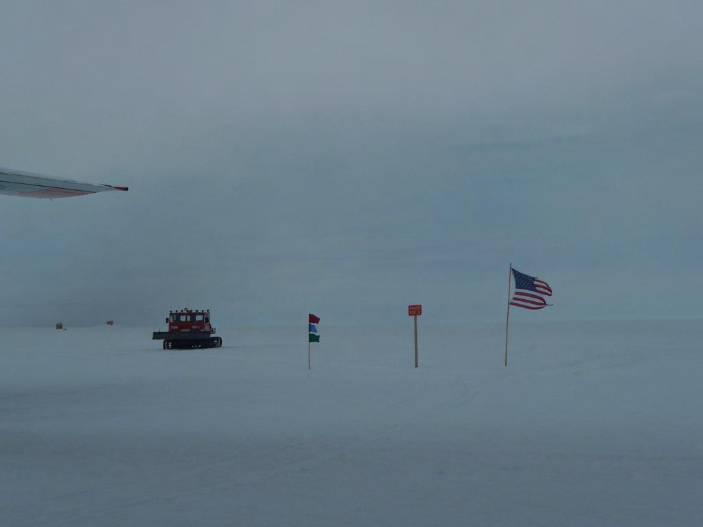 Camp Raven in the Center of Southern Greenland. Sign reads PopulaLon 2 for the permanent science team there!