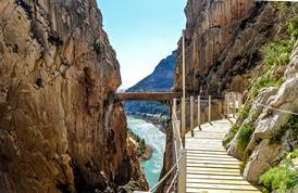 Paddle along the turquoise water in a kayak. Enjoy lunch at a local Venta, or roadside cafe. Later, hike the Caminito del Rey.
