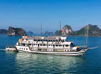 Travel along the South China Sea, snaking from cliff to jungle-covered cliff past beaches and islands and through the lush green mountains via the Hai Van Pass to Danang.