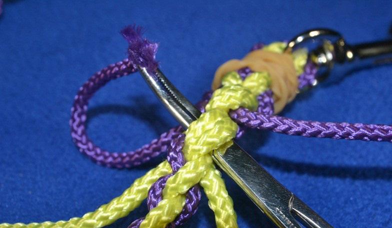 9. Using forceps or small pliers, carefully weave the loose strands into the main part of the leash.