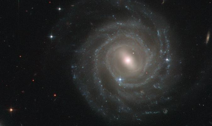 Delić galaksije: spiralni kraci Smatra se da je prečkasta spiralna galaksija UGC 12158 vrlo slične građe kao Mlečni put.