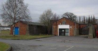 Detached brick industrial unit with pitched mineral felt covered timber roof Office
