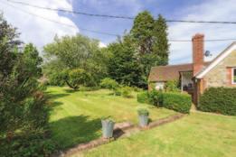Beyond the courtyard and garages, down a very small neighbouring country lane are 2