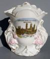 Lot # 67 - China Vase with color image of "World's Fair Electricity Building". The side of the vase has handle like extensions with raised pink flowers on them. Marked "Germany" on the bottom.