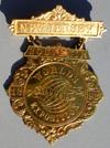 Reverse of inner medal pictures western hemisphere with "Chicago USA" written on North America. Size: 3 1/2" high by 1 9/16" wide.