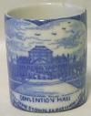 Lot # 234 - Blue ceramic (transferware) match holder with the image of the Convention Hall at the 1907 Jamestown Exposition. The interior is a white ceramic. Size: Diameter: 1.