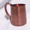 Lot # 310 - Solid copper mug with the Star of Arcturus logo with the date 1934 engraved on one side and the Travel Building on the other side. Engraved in the center in script "Pat Mariana.