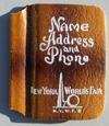 Lot # 401 - Small "Name Address and Phone Book with Trylon and Perisphere and "New York World's Fair" pictured on the cover.