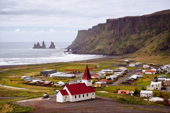 Continue to the charming small village of Vik to visit the Black Beaches and dramatic rock formations Visit