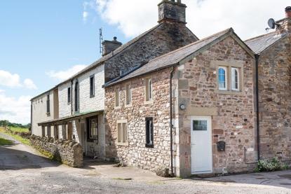Outside The farm has various outbuildings, including workshops, stables, a large cow shed and a two storey stone