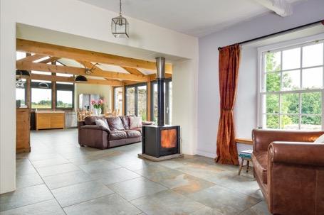 fireplaces, exposed beams, delightful windows and red sandstone