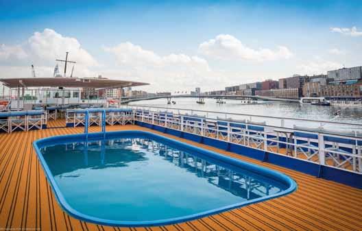The sun deck offers sufficient seating, deck chairs and a heated pool to relax.