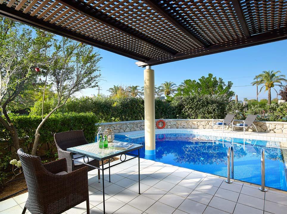 with Jacuzzi equipped with sun loungers and pool towels with view to the pools of the hotel.