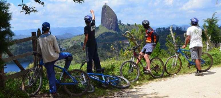 Day 9: Guatape Cross-Country Bike Ride One of our favorites cross country mountain bike tours explores the lush valleys, mountains and lake area west of Medellin.