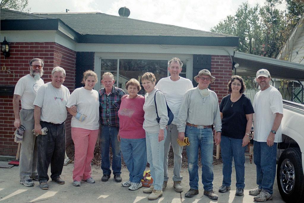 Volunteers with the homeowners (4th and 5th from left) and their daughter and her husband (right), down from Jackson, MS to help The