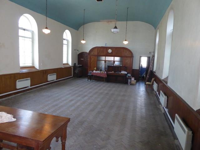 It has timber block flooring to the main Chapel with some leaded glass windows, and is a Grade II Listed building.
