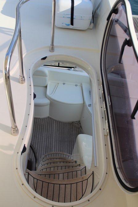 Access to the flybridge is from a sleek stairway.