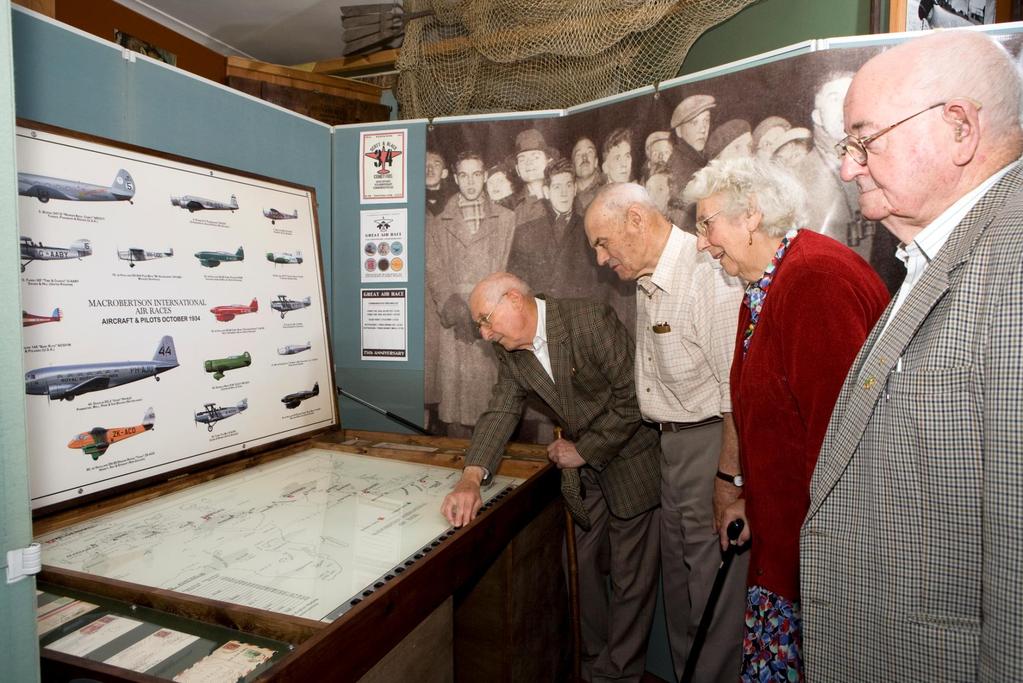 Museum volunteers and reminiscence worker Julie Heathcote invited people to look at the Museum s commemorative exhibition and discuss their memories