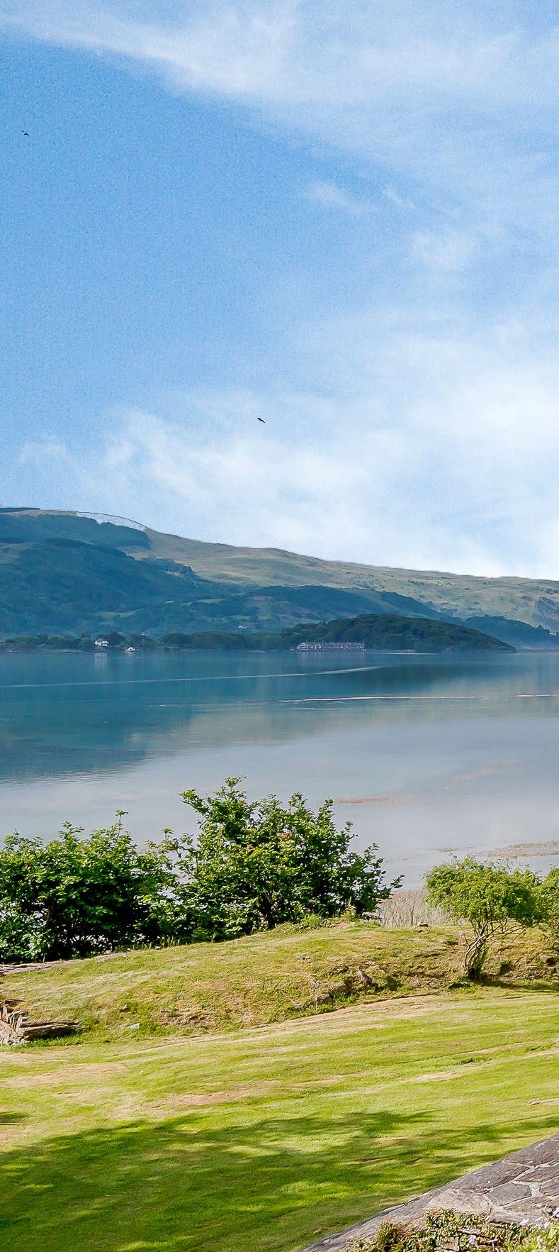 A beautiful country house standing in idyllic grounds with a swimming pool, tennis court, quay and spectacular views over the Mawddach Estuary.