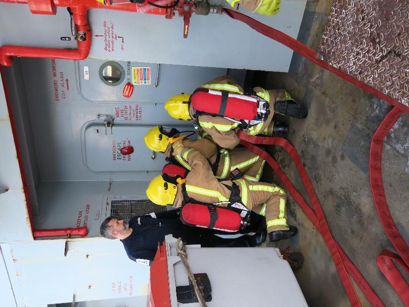 Left: Personnel attempt a re-entry into a compartment. Right: Training with smoke to simulate realistic conditions during a main machinery space fire.