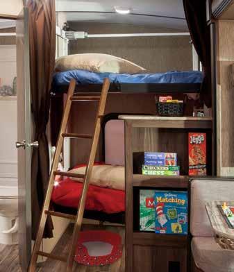 Our unique multi-purpose area serves as a sleeping room with two retractable and height-adjustable bunks, a play space for the kids and the four-legged members of the family, or a storage spot with
