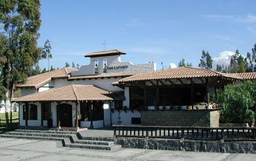 HACIENDA ABRASPUNGO, Riobamba Entrance to the Hacienda Within are pleasant gardens The lounge has a