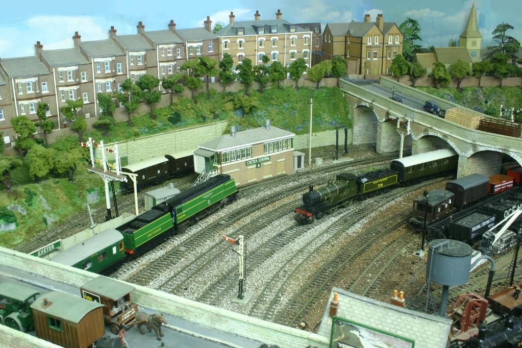 A view of the approach to the station showing the large signal box and behind this is a cattle dock.