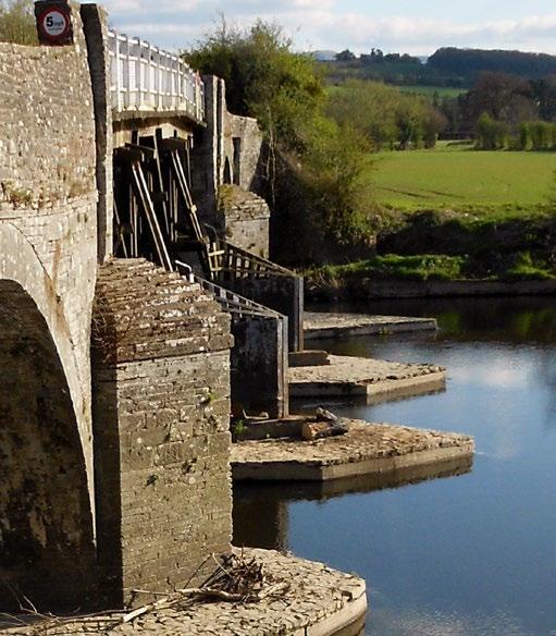 A new Act of Parliament in 1797 permitted the construction of a part stone and part wooden bridge by Thomas Longfellow and his partners which would allow the water to pass through and the design is
