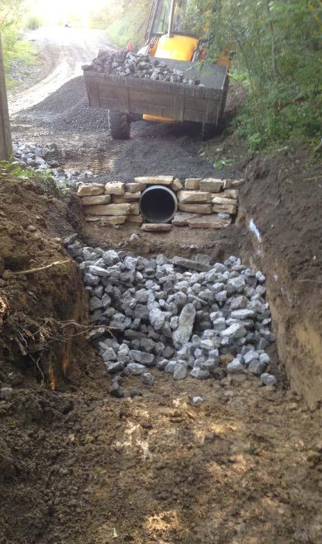 constraints prevent drainage dispersal - Installation of a through the bank pipe - New headwalls built on an existing 4 stream pipe.
