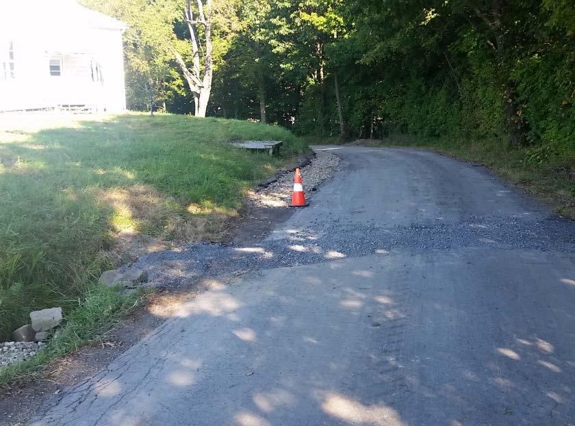 Over 500 feet of underdrain and 3 new crosspipes were installed on the section of road near the schoolhouse.
