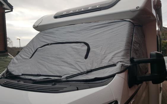 Magnets located in the cover help keep it in place. Blinds Each window, including the main windscreen and roof lights has blinds.