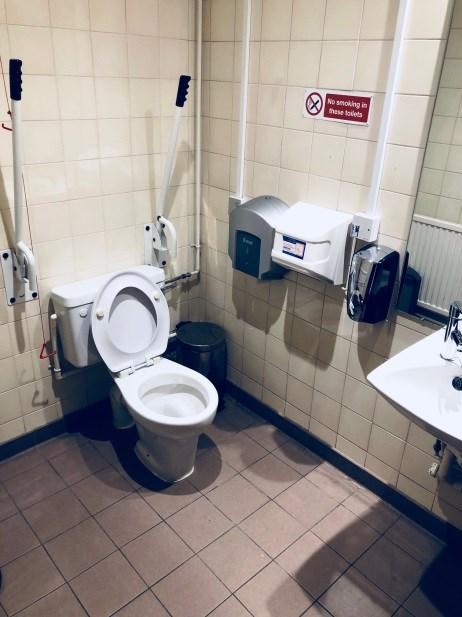 In fully accessible bathrooms the shower is separate. The height of the WC from floor to seat is 19" and the transfer side when looking at the WC is to the right. The height of the wash basin 27.
