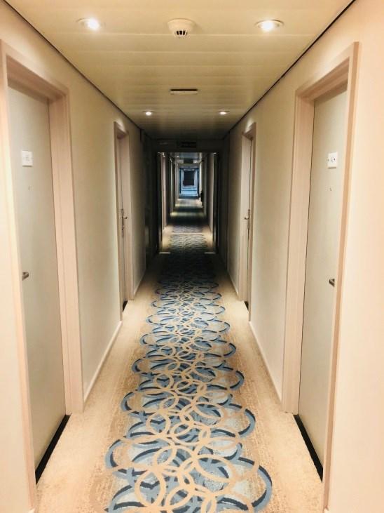 The corridors are well lit with wall lights and spotlights in the ceiling; the corridor width is 58" wide. The flooring on all corridors is carpeted.