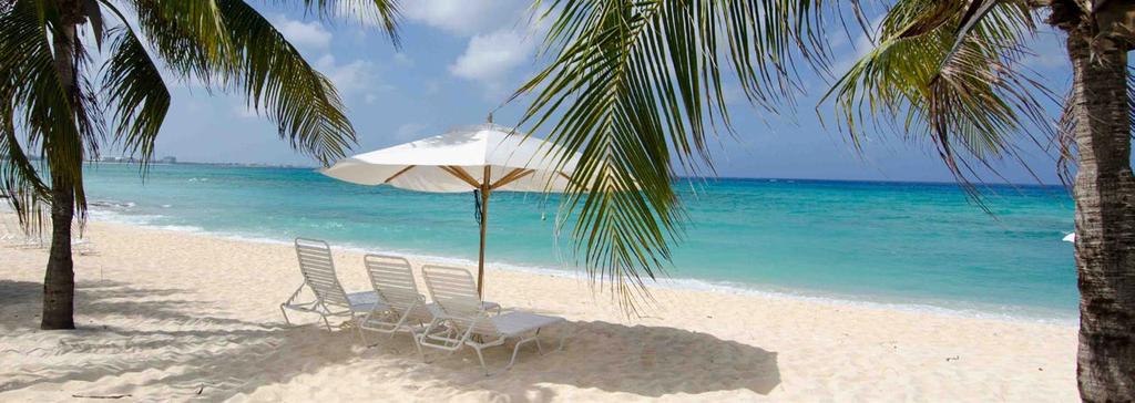TRAVEL TIPS & INFORMATION CLIMATE Grand Cayman maintains a tropical climate year-round with an average temperature of 84 F (28 C) in the summer, and dropping to around 75 F (23 C) in the winter.
