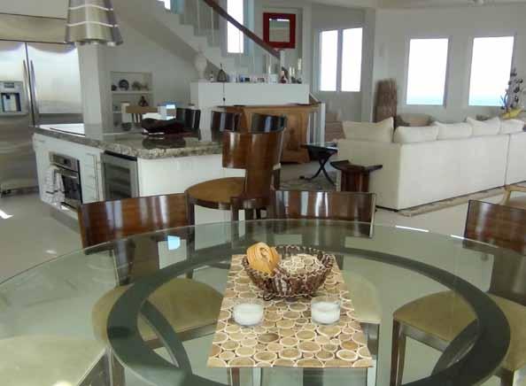 Open Plan Dining The delicious meals cooked in the kitchen can be served at the stylish glass-topped table that can