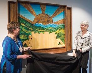 Members of the Trail & District Library unveil their donor piece at the Trail Riverfront Centre.